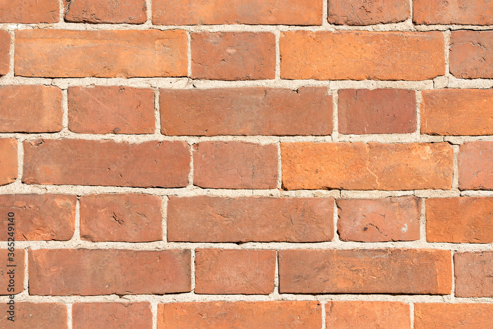 Fototapeta premium Red brick wall, abstract texture close-up