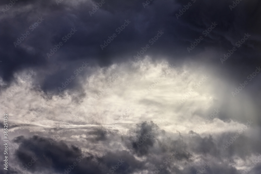 Sun's rays break through storm clouds