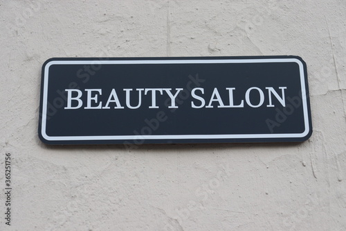 beauty salon nameplate on wall © Mikalai Drazdou