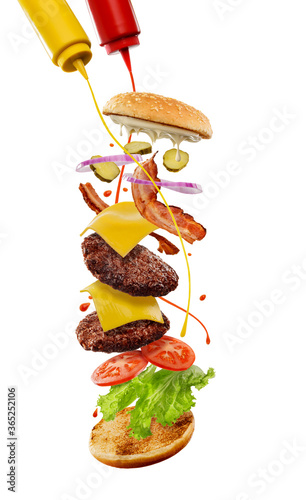 Cheeseburger with adding of mustard and ketchup