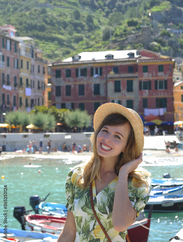 Portrait of young woman, harbor of Vernazza, Cinque Terre, Italy.