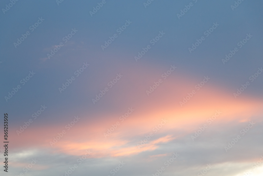 sky and cloud in blue and orange gradient colors. Colorful smooth sky in dusk.