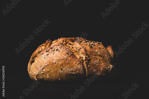Fotografie Fresh french bread on a black background