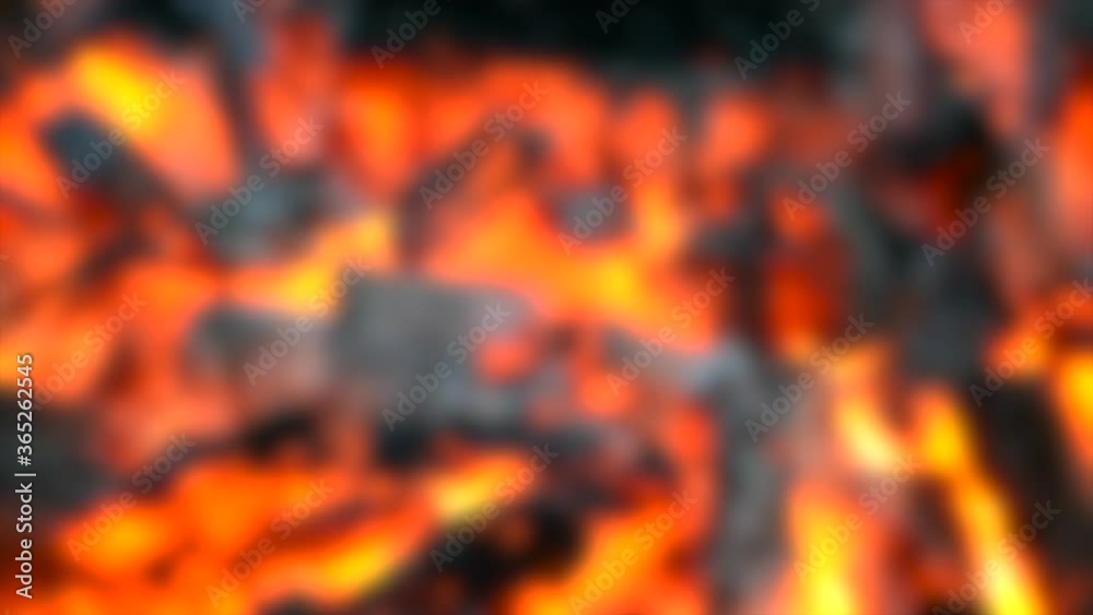 Blurred background. burned-out embers gray burn in the fire close-up top
