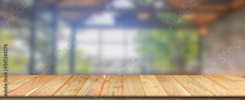 Empty wooden table and blur glass wall background window room interior decoration background, product montage display,can be used for display or montage your products.