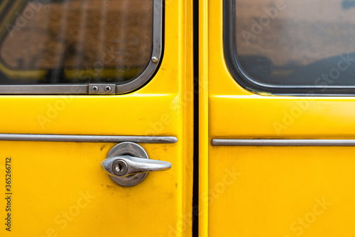 Stampa su tela Close-up detail of a Black Yellow vintage citroen 2cv car