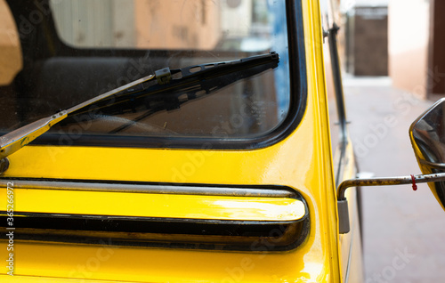 Fototapete Close-up detail of a Black Yellow vintage citroen 2cv car