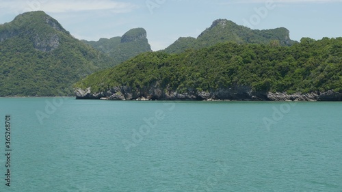 Group of Islands in ocean at Ang Thong National Marine Park near touristic Samui paradise tropical resort. Archipelago in the Gulf of Thailand. Idyllic turquoise sea natural background with copy space © Dogora Sun