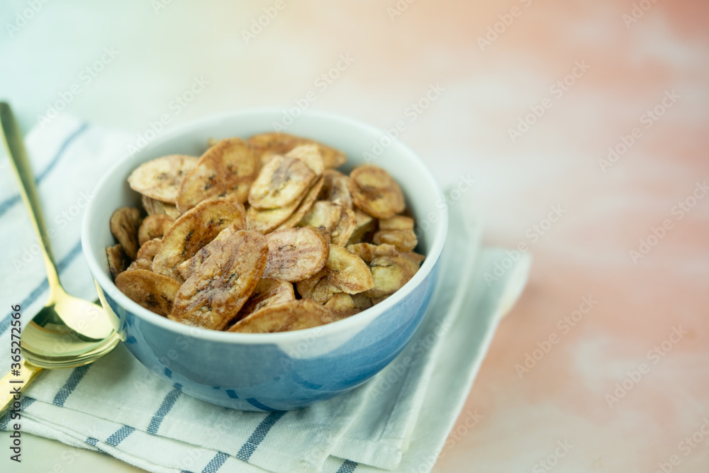 Homemade dehydrated banana chips cuisine fried in hot oil baked. Homemade dehydrated banana chips cuisine fried in hot oil baked.