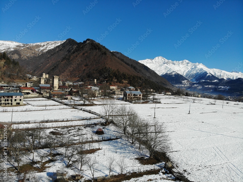 Georgia. Svaneti Region, mountain city Mestia. Land of Towers. View from above, perfect landscape photo, created by drone. Aerial photo from travel.