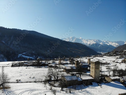 Winter Georgia. Svaneti Region, mountain city Mestia. Svan Towers. View from above, perfect landscape photo, created by drone. Aerial photo from travel.