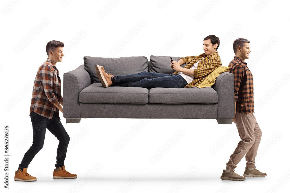 Guy on sofa using a mobile phone and two men carrying the sofa Guy on sofa using a mobile phone and two men carrying the sofa
