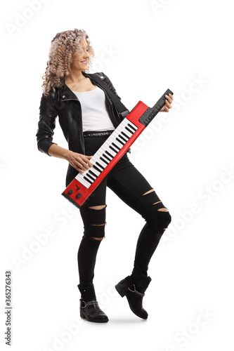 Vintage style female musician with a keytar synthesizer