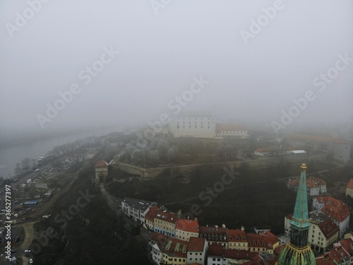Slovakia, Bratislava. Historical centre. Aerial view from above, created by drone. Foggy day town landscape, travel photography. Old city castle