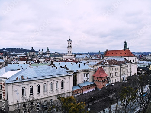 Aerial view from above of Lviv city, Ukraine. Beautiful drone photography. Main square and rooftop of city hall tower