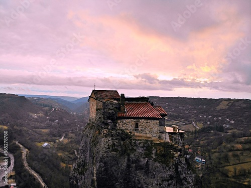 Beautiful aerial drone photography. Country Georgia from above. Mountain Monastery and Church of Katskhi, Chiatura region. Sunset aerial view