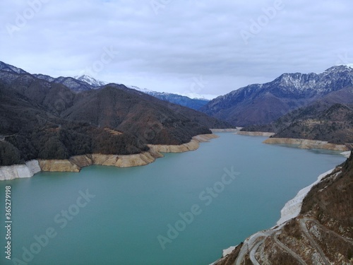 Georgia. The Enguri Dam is a hydroelectric arch dam. View from above, perfect landscape photo, created by drone. Aerial photo, mountain and river view.