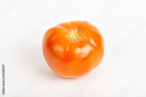 ripe red tomato on white background