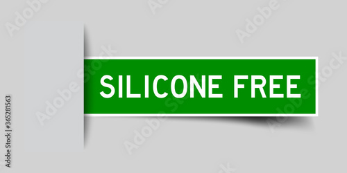 Inserted green color sticker label with word silicone free on gray background