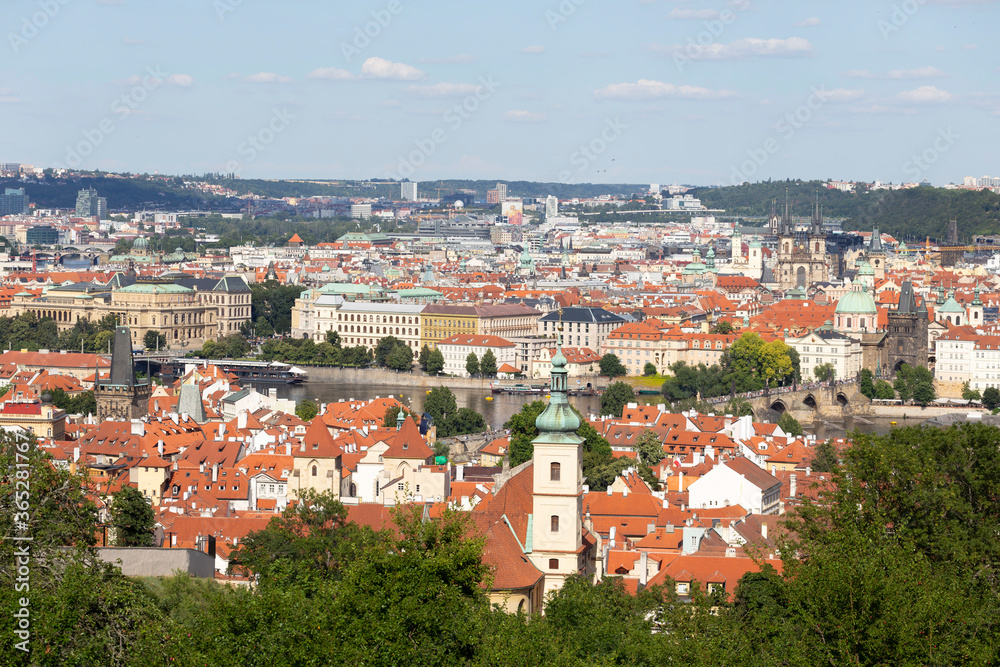 Prague City with Charles Bridge and green Nature from the Hill Petrin, Czech Republic