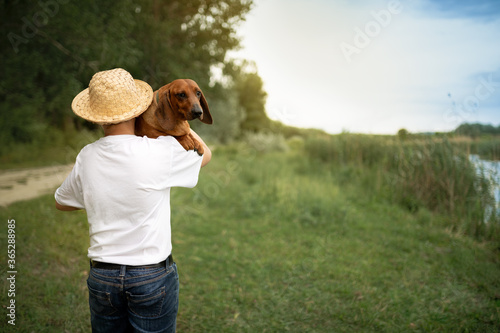 Young boy with dog in nature