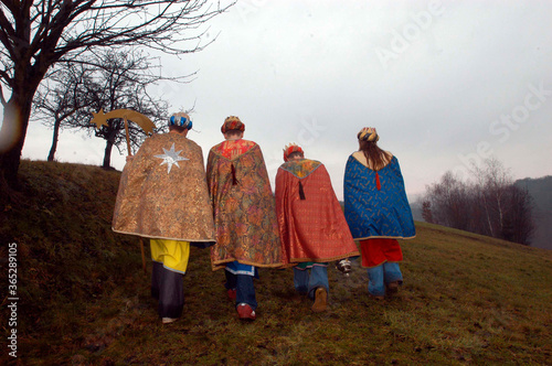 Carol singers on Epiphany walking from home to home photo