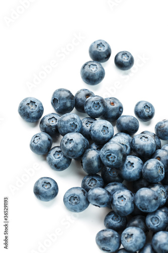 Blueberries isolated on a white background. A scattering of ripe, juicy, delicious and healthy berries.