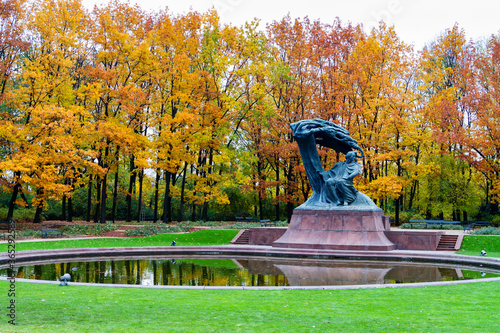 WARSAW, POLAND - OCTOBER 26, 2016: Fryderyk Chopin monument in autumn scenery of the Royal Lazienki Park in Warsaw, Poland, designed around 1904 by Waclaw Szymanowski (1859-1930). photo