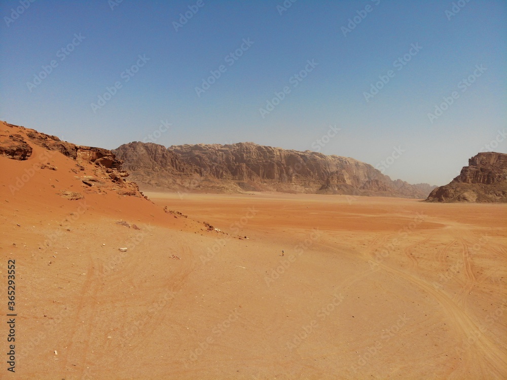 Amazing view from above on the huge, red, hot and very beautiful desert Wadi Rum. Kingdom of Jordan , Arab country in Western Asia