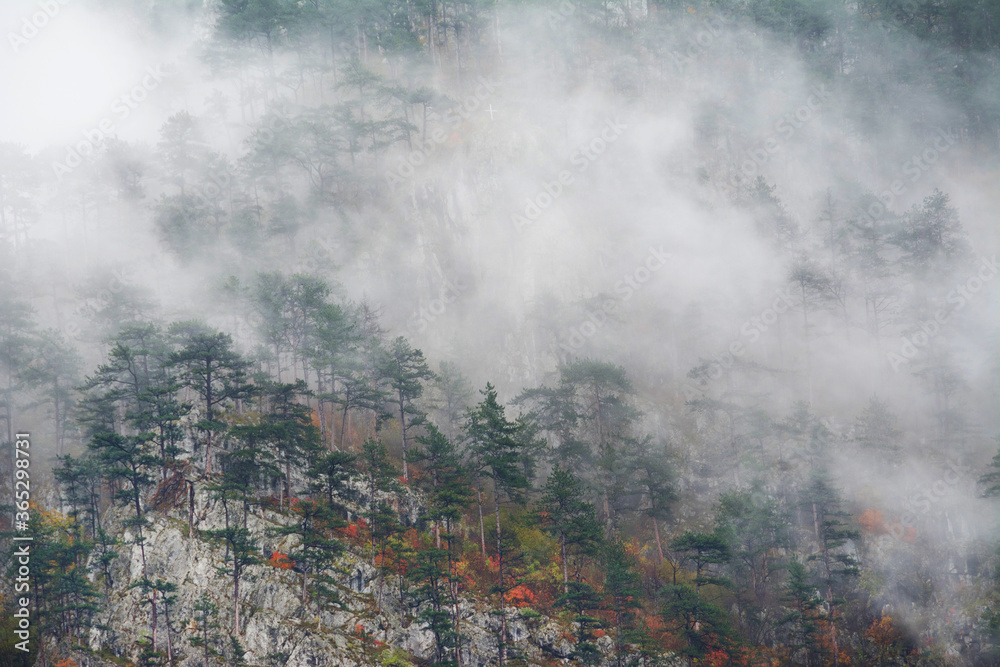Autumn foggy landscape in Cernei Mountains, Romania, Europe