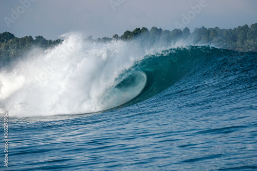 Perfect blue aquamarine wave, empty line up, perfect for surfing, clean water, Indian Ocean, Mentawai.