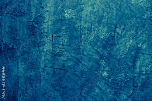 Abstract blurred and grunge deep blue stucco textured background for navy blue backdrop and wallpaper