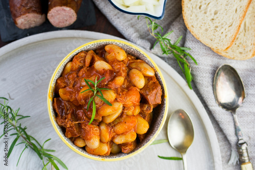 Stewed beans in tomato sauce with herbs and spices.  Top view. photo