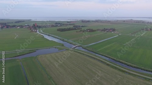 Droneshots of sheeps in the fields of Holland photo