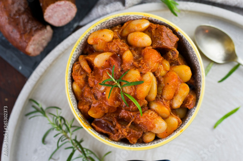 Stewed beans in tomato sauce with herbs and spices. Top view.