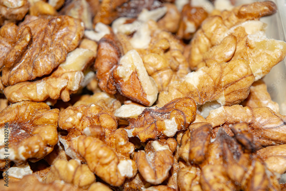 Peeled walnuts close-up. Surface texture. Healthy diet. Peeled walnuts close-up. Surface texture. Healthy diet.
