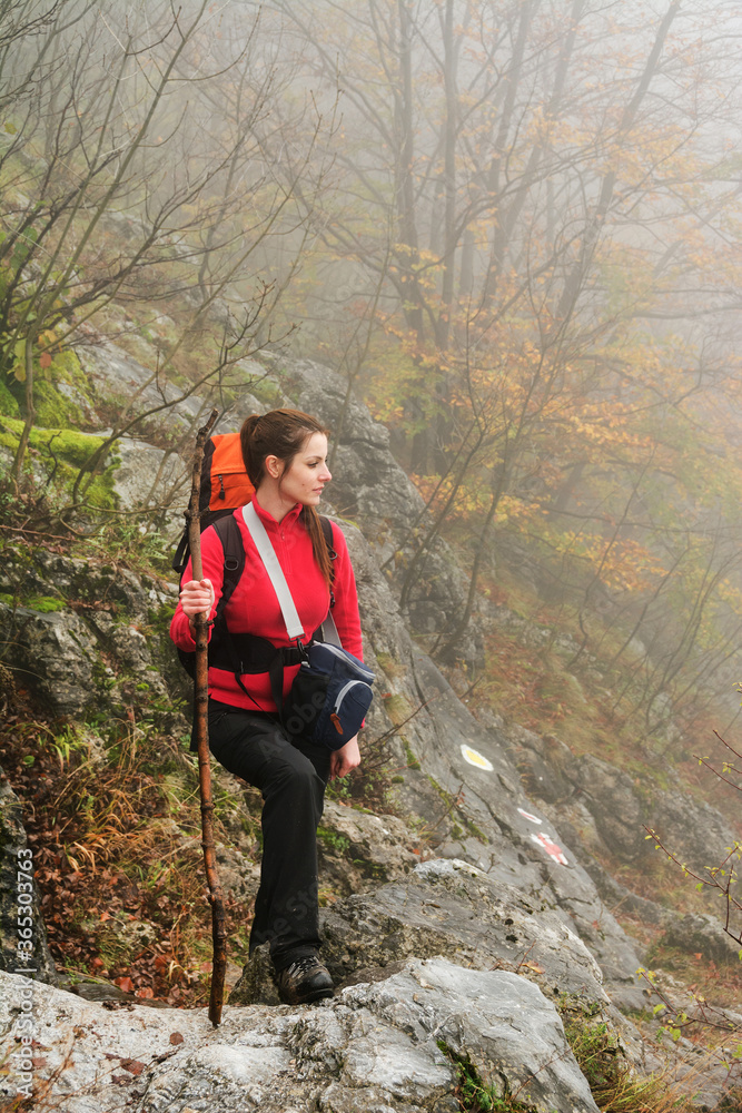 Naklejka premium Young brunette girl trekking in Mehedinti Mountains, Romania, Europe