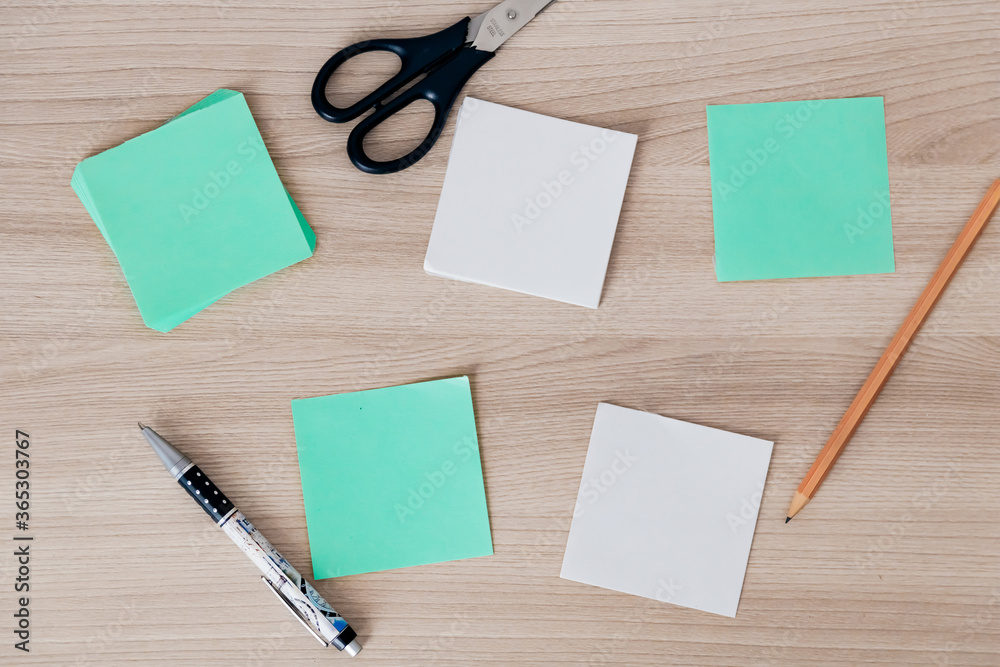 paper stickers and stationery on a wooden table