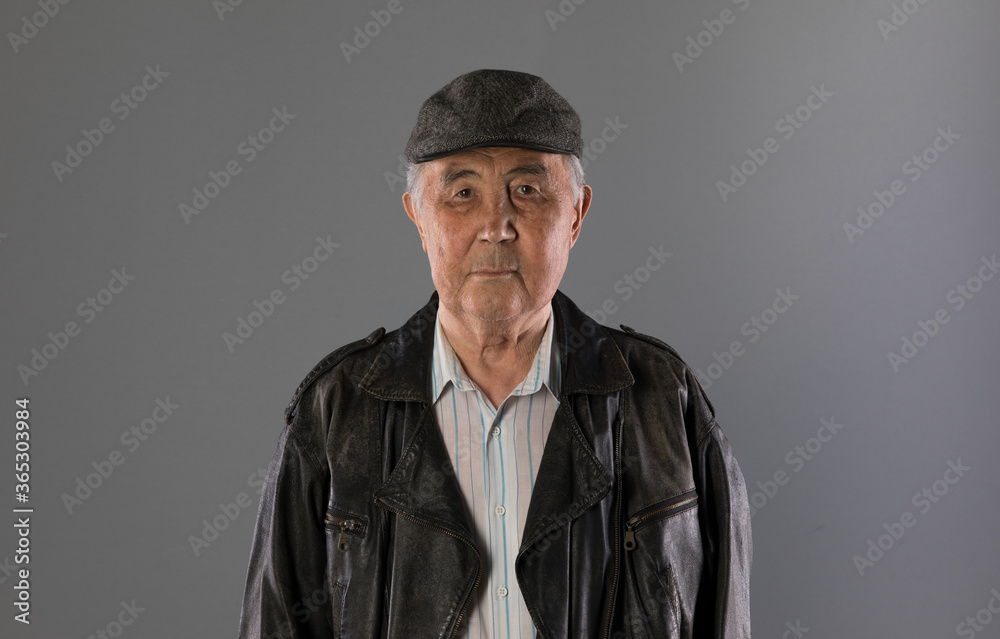 grandfather, pensioner, portrait of an old man on a gray background grandfather, pensioner, portrait of an old man on a gray background