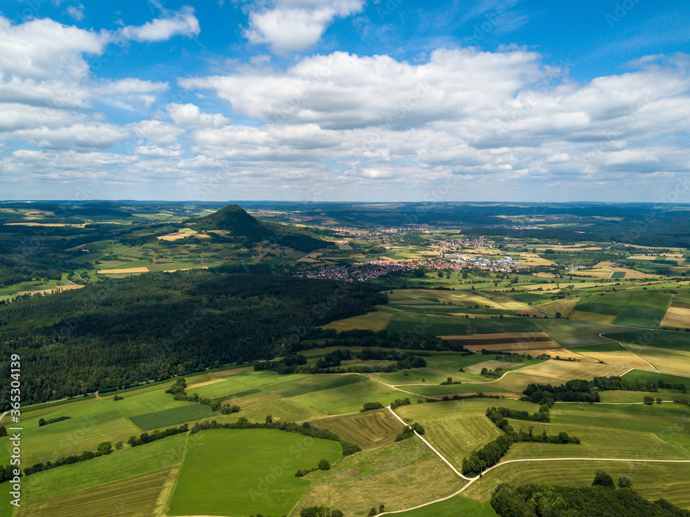 Aerial view over the long extinct volcanoes of the Hegau region near Lake Constance in Germany.