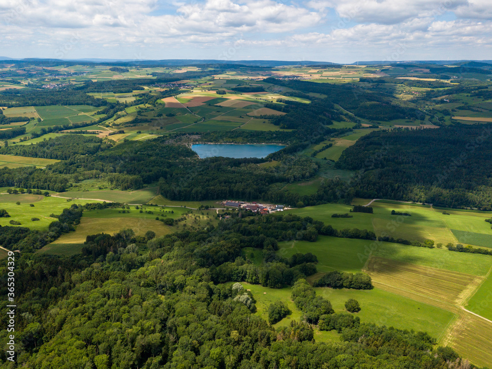 Aerial view on the lake Binningen in Hegau from the Hegau volcanic cone Hohenstoffeln, Germany.