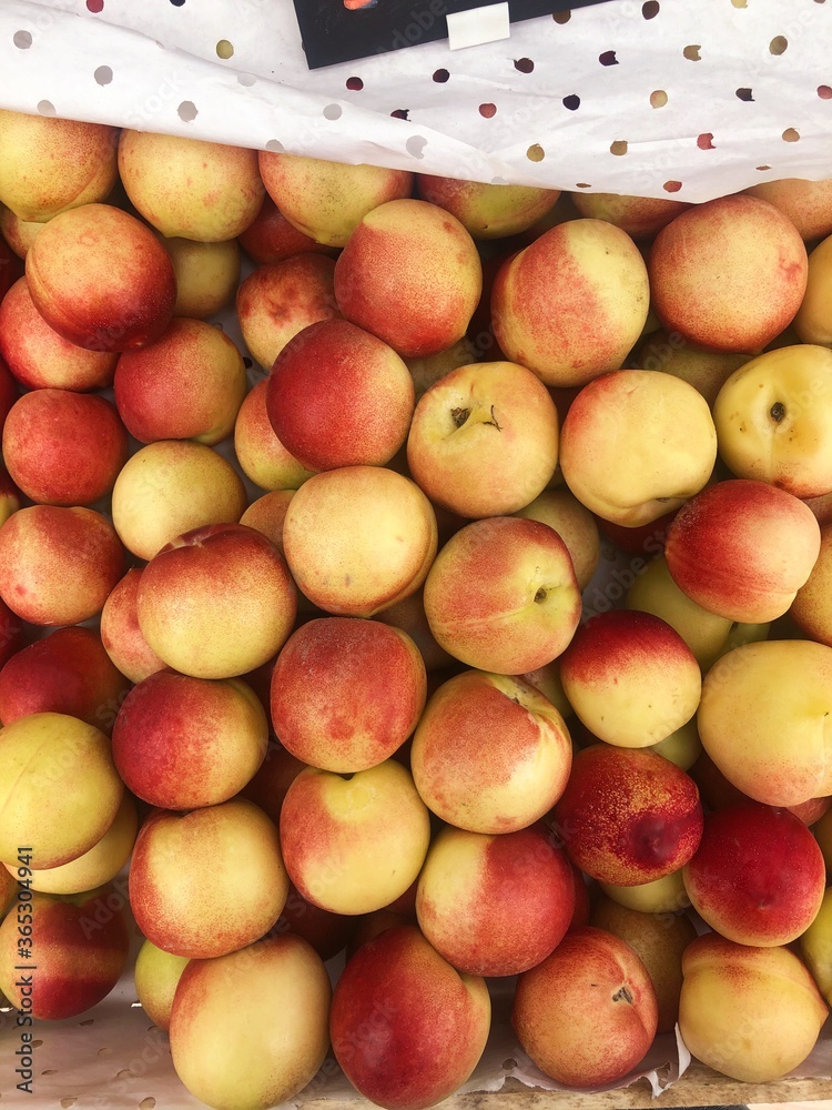 Ripe juicy red nectarines on the market 