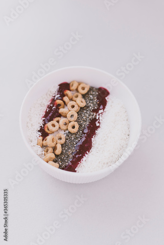 Appetizing breakfast smoothie bowl in a white plate. Healthy dessert recipe. 