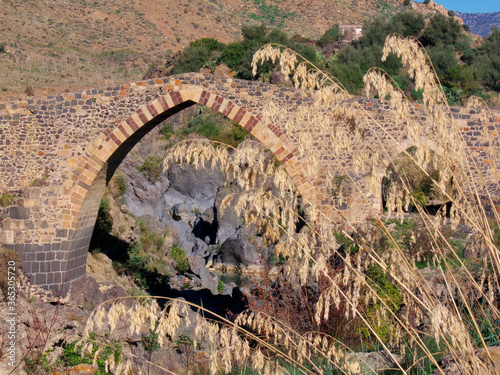 Arabic Arch Of A Bridge Over The River Simeto, An Example Of Ancient Sicilian Architecture