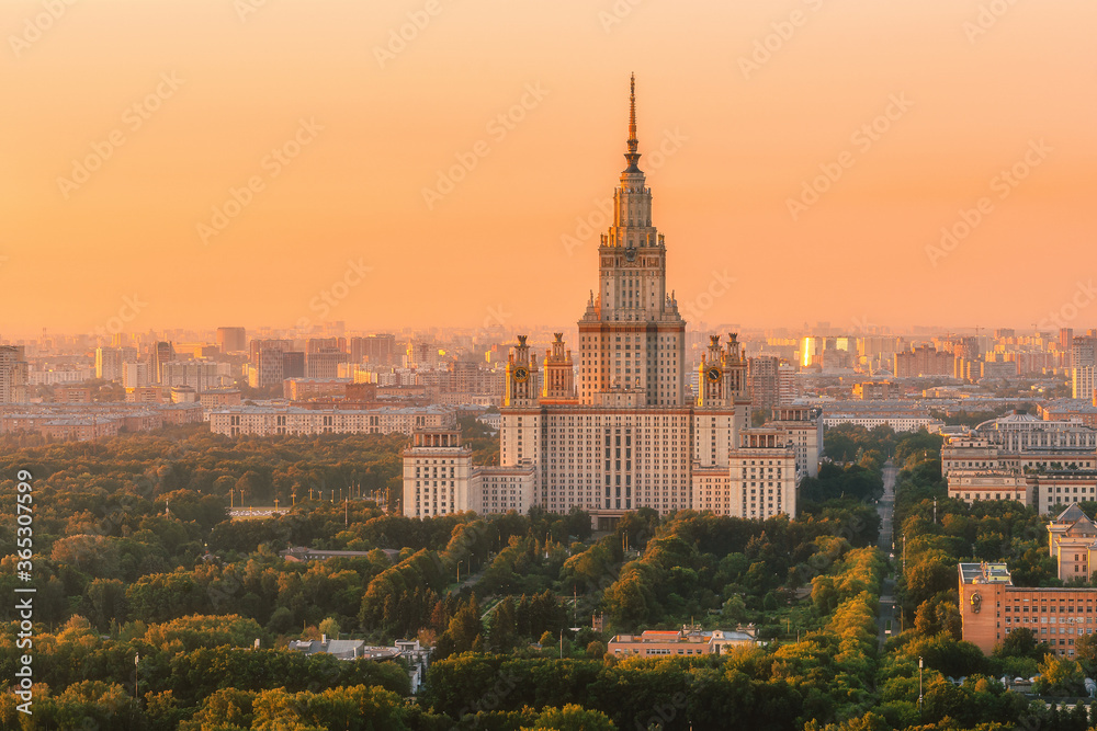 Moscow State University from a height. Panorama of the city at sunrise. Moscow landmark in the soft light of a golden dawn. A park. Stalin's skyscraper