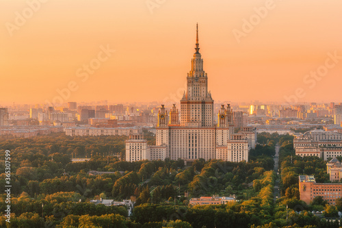 Moscow State University from a height. Panorama of the city at sunrise. Moscow landmark in the soft light of a golden dawn. A park. Stalin's skyscraper