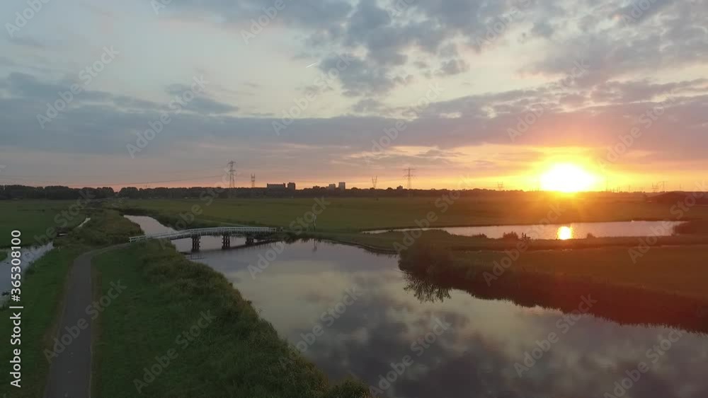 Droneshots of sheeps in the fields of Holland