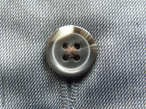 Gray and white color 4 holes sew through button on trousers