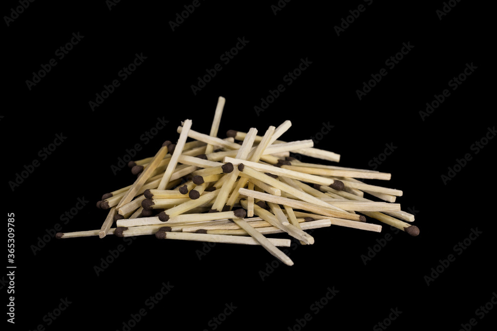 a stack of scattered Match sticks isolated black background a stack of scattered Match sticks isolated black background