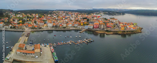 Aerial view in Camarinas. Galicia. Coastal town with boats in Spain photo